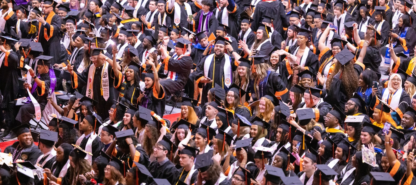 Rows of graduating students in academic regalia