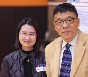 Two faculty members at a research forum
